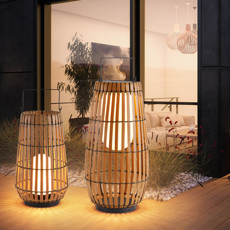 إضاءة خارجية LED للمناظر الطبيعية على شكل أسطوانة شمسية مقاومة للماء من الحديد بتصميم عصري مقلد كراتان للحديقة 