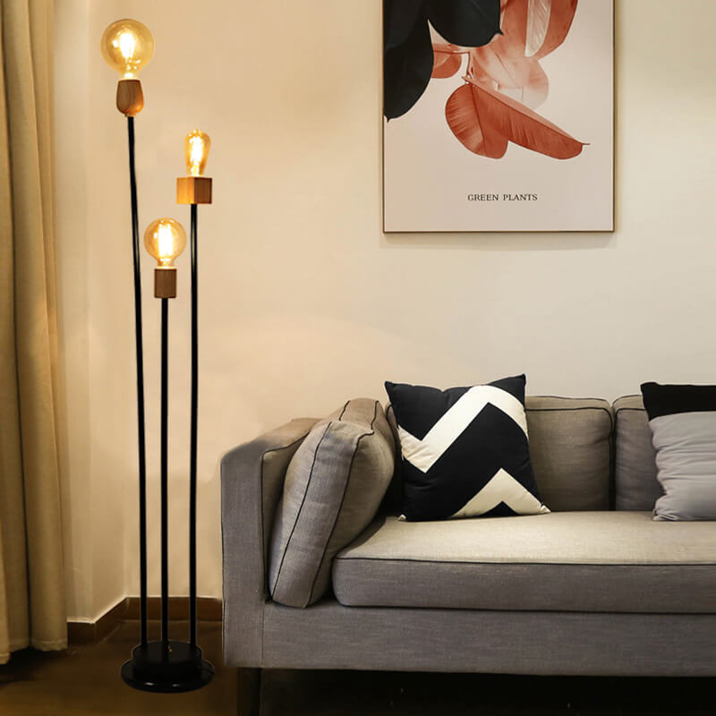 Lampe de sol industrielle rétro en fer avec cadre noir fini et trois globes en verre 