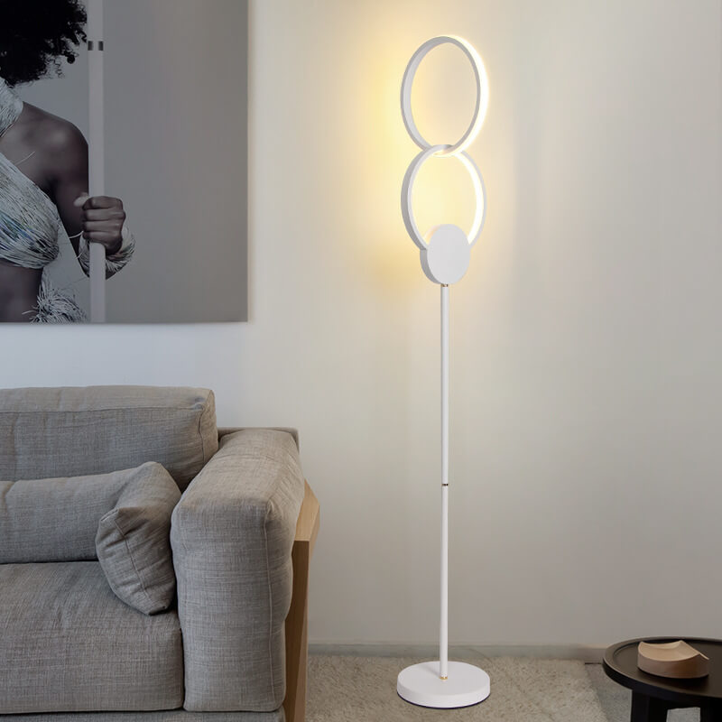 Lámpara de pie LED con base de hierro interconectada de anillos dobles de acrílico de simplicidad moderna 