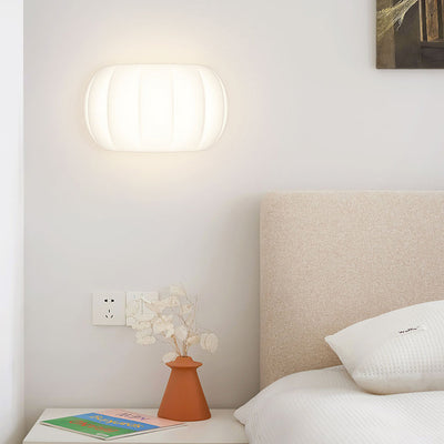 Applique murale LED elliptique en forme de citrouille en fer et acrylique de simplicité moderne pour chevet 