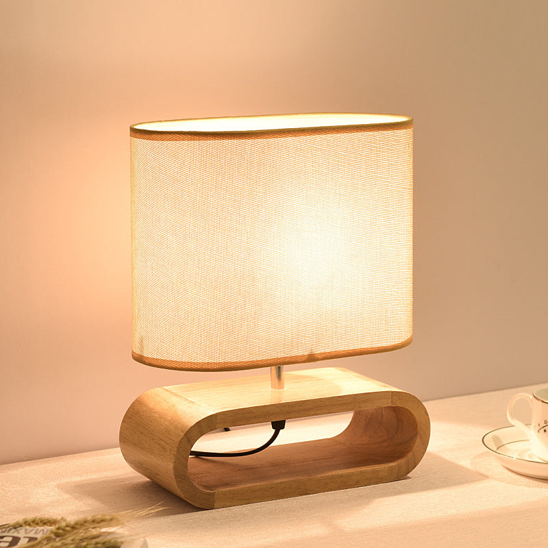 Lámpara de mesa contemporánea nórdica de cilindro de tela de madera elíptica de 1 luz para estudio 