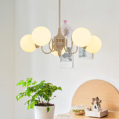Lustre contemporain rétro à branches courbées avec tige ronde et boules en fer et verre 3/5 lumières pour salon 