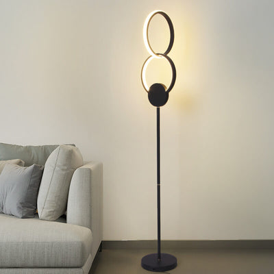 Lámpara de pie LED con base de hierro interconectada de anillos dobles de acrílico de simplicidad moderna 