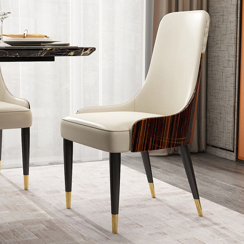 Chaise de salle à manger contemporaine en cuir nordique avec dossier et accoudoirs en bois, acier inoxydable et éponge 