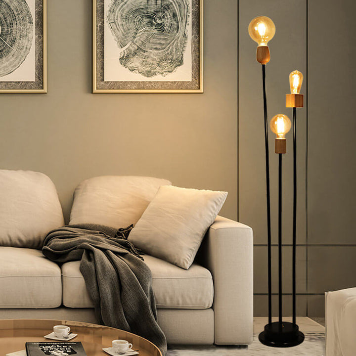 Lampe de sol industrielle rétro en fer avec cadre noir fini et trois globes en verre 