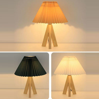 Lámpara de mesa de 1 luz con pantalla de tela plisada trapezoidal minimalista moderna y trípode de madera para dormitorio 