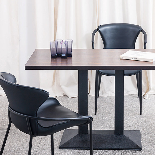 Chaise de salle à manger en cuir et métal avec dossier trapézoïdal minimaliste moderne pour salle à manger 