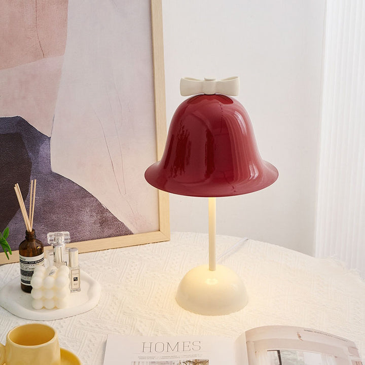 Moderne minimalistische Tischleuchte mit Schleifenglocke im Creme-Ton und LED 