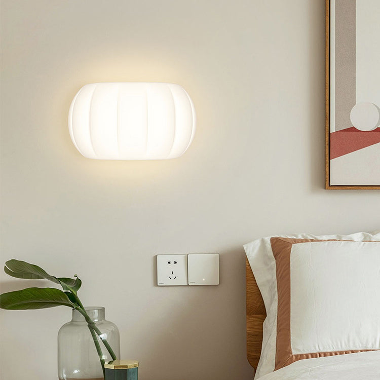 Applique murale LED elliptique en forme de citrouille en fer et acrylique de simplicité moderne pour chevet 