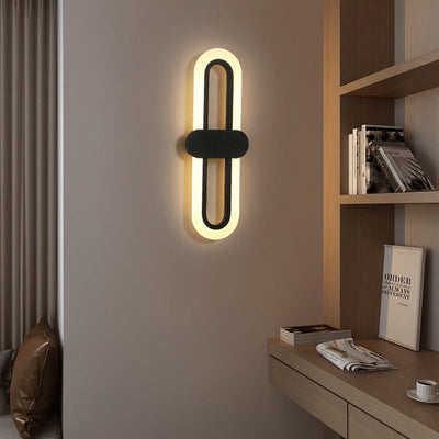 Applique murale LED en fer acrylique ovale de simplicité contemporaine pour salon 