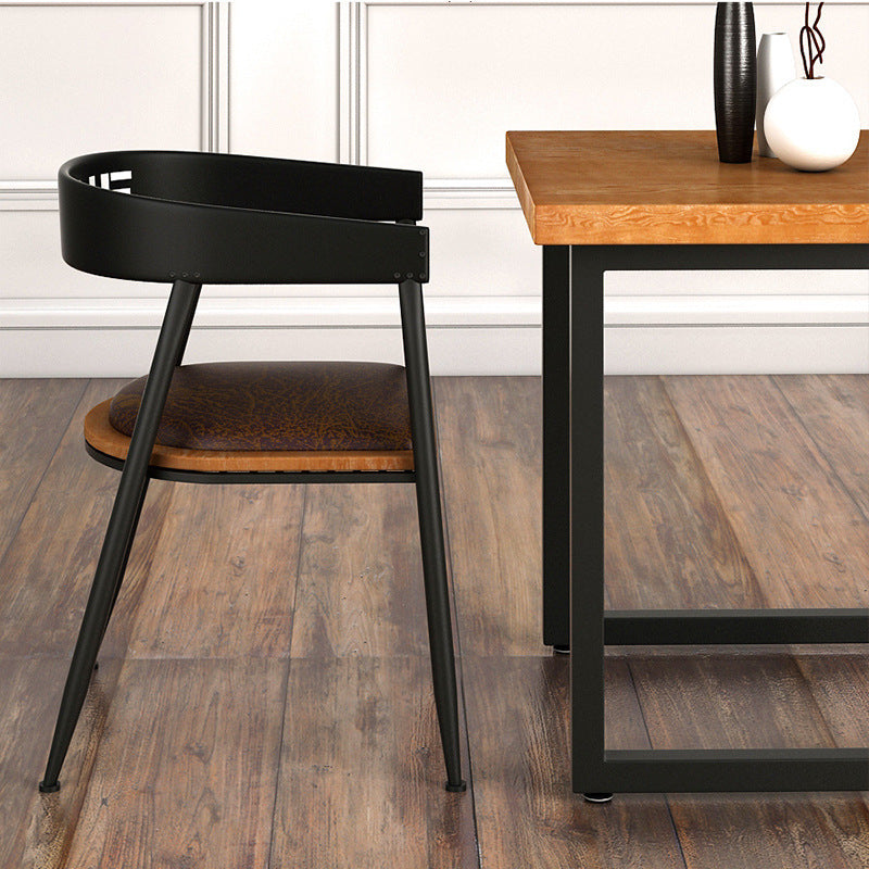 Silla de comedor contemporánea nórdica con estructura de hierro redonda y tapizada en cuero sintético con respaldo y reposabrazos para comedor 