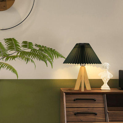 Lámpara de mesa de 1 luz con pantalla de tela plisada trapezoidal minimalista moderna y trípode de madera para dormitorio 