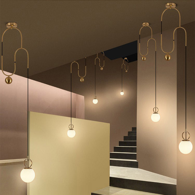 Combinación de orbe escandinavo contemporáneo de hierro curvado con vidrio, lámpara colgante de 1 luz para dormitorio 