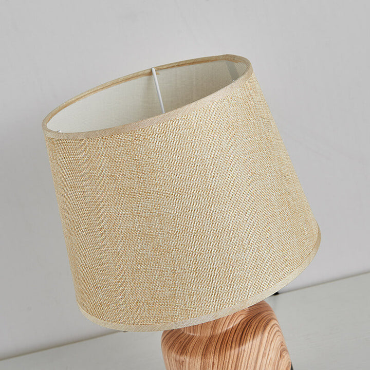 Moderne minimalistische Holzmaserung Stoff Keramik 1-Licht Tischlampe 