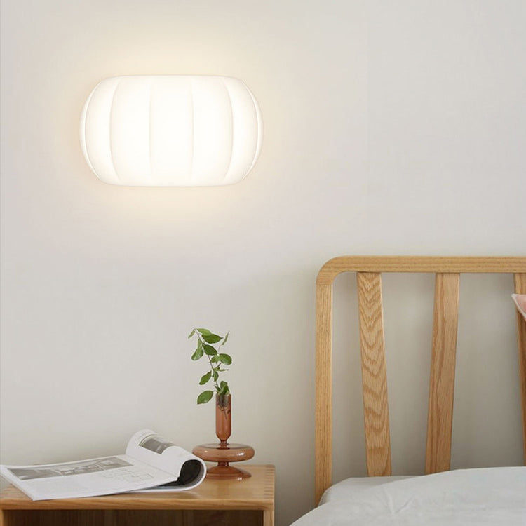 Applique murale LED elliptique en forme de citrouille en fer et acrylique de simplicité moderne pour chevet 