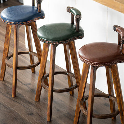 Tabouret de bar pivotant contemporain rond en cuir avec pieds en bois, dossier bas et repose-pieds pour salle à manger 