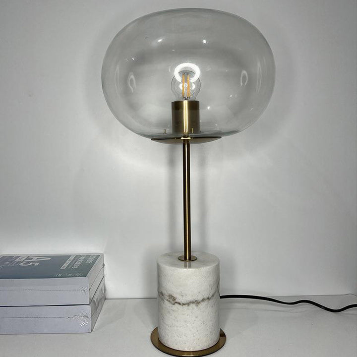 Lampe de table moderne minimaliste à une lumière avec base en marbre cylindrique et boule ronde en fer et verre pour salon 