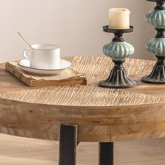 Traditioneller runder Vintage-Couchtisch aus MDF-Holz mit Used-Look und Eisen-Kreuzbeinen für das Wohnzimmer 