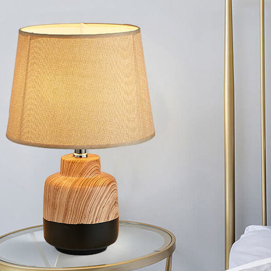 Moderne minimalistische Holzmaserung Stoff Keramik 1-Licht Tischlampe 
