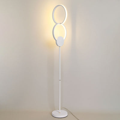 Lámpara de pie LED con base de hierro interconectada de anillos dobles de acrílico de simplicidad moderna 