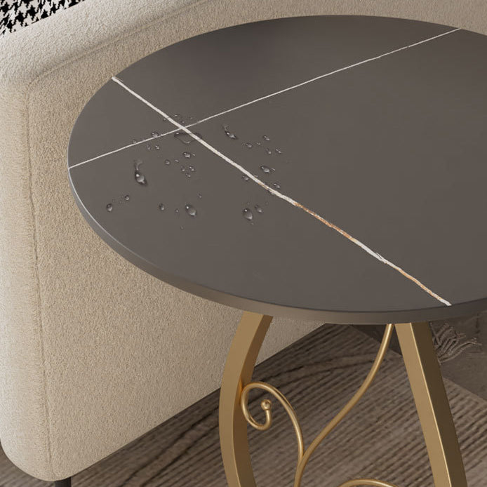 Table basse moderne de luxe ronde avec plateau en pierre frittée et base en métal pour salon 