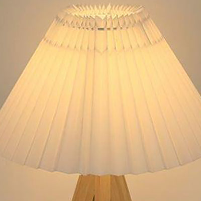 Lámpara de mesa de 1 luz con pantalla de tela plisada trapezoidal minimalista moderna y trípode de madera para dormitorio 