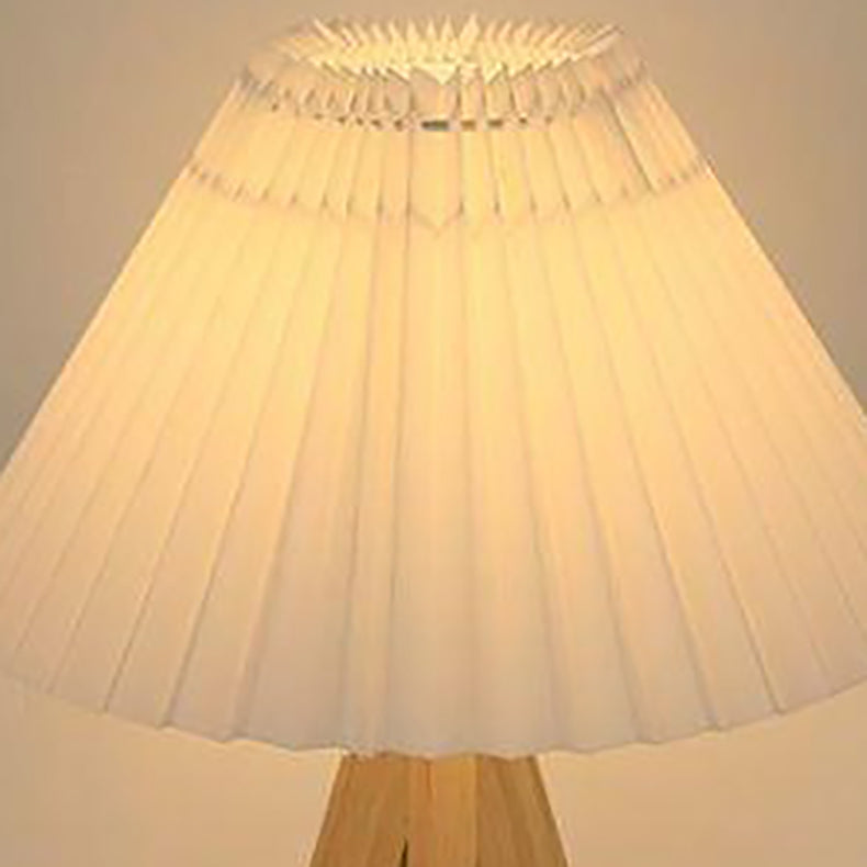 Lámpara de mesa de 1 luz con pantalla de tela plisada trapezoidal minimalista moderna y trípode de madera para dormitorio 
