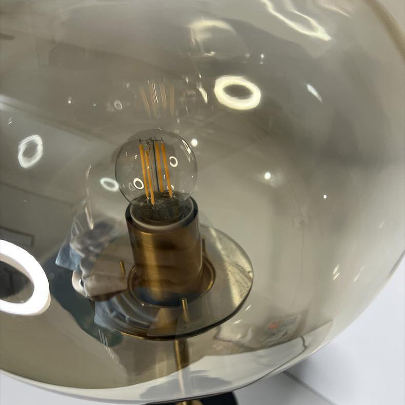 Lampe de table moderne minimaliste à une lumière avec base en marbre cylindrique et boule ronde en fer et verre pour salon 