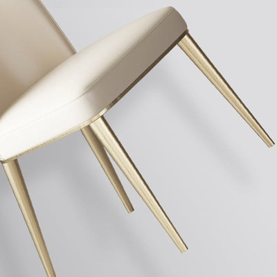 Chaise de salle à manger contemporaine nordique en cuir incurvé avec dossier rembourré et pieds effilés en métal 