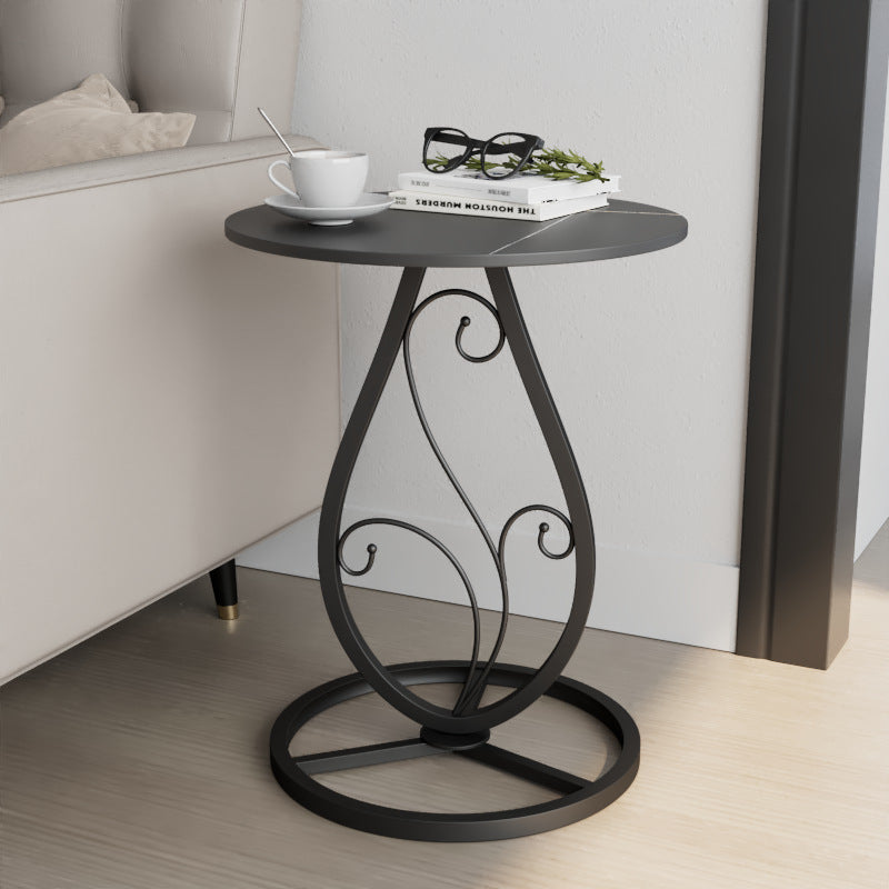 Table basse moderne de luxe ronde avec plateau en pierre frittée et base en métal pour salon 