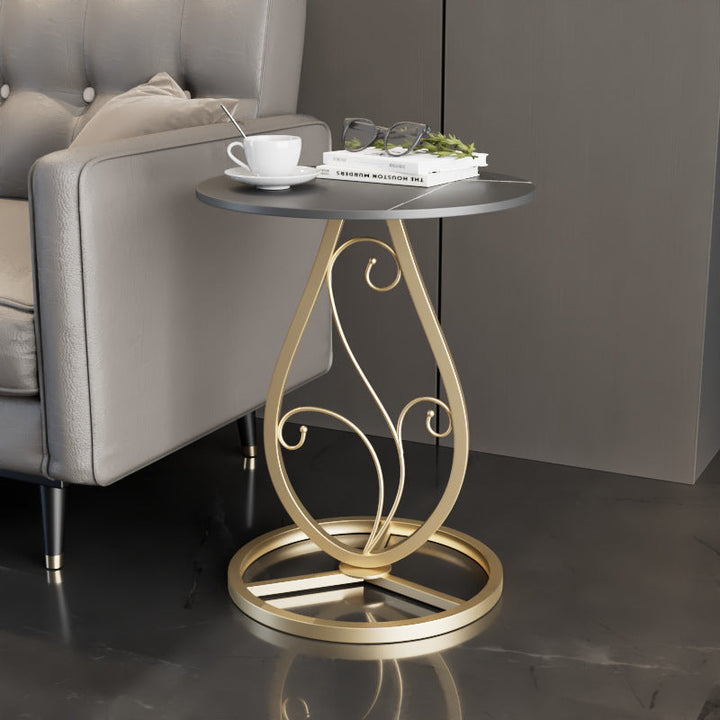 Table basse moderne de luxe ronde avec plateau en pierre frittée et base en métal pour salon 