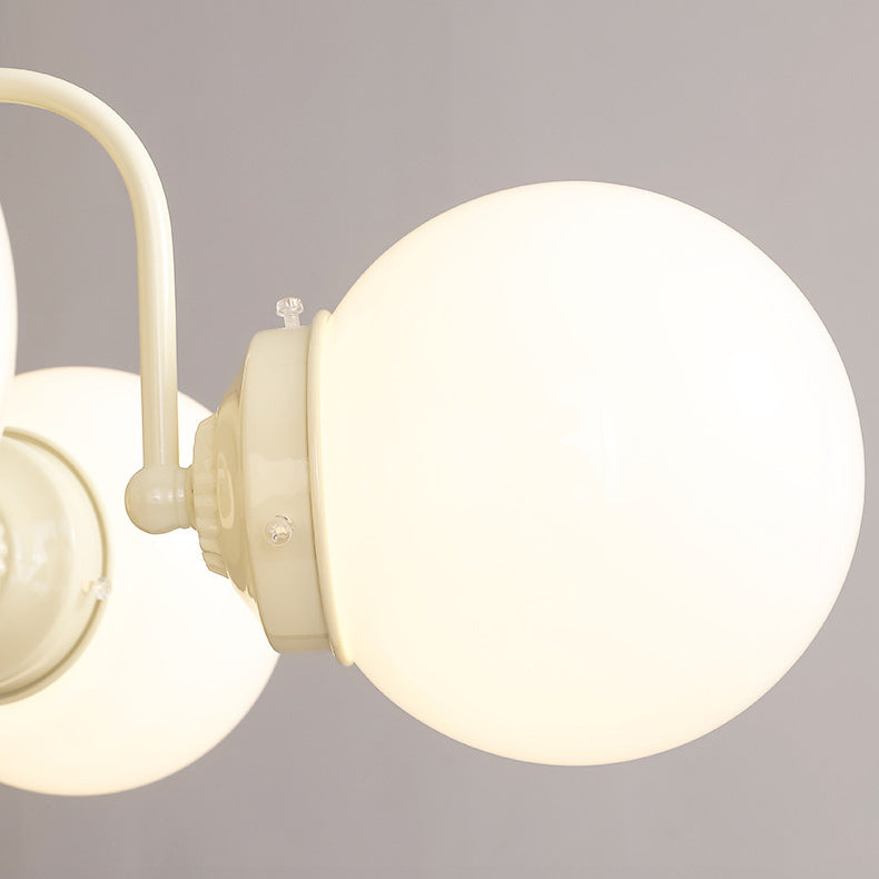 Lustre contemporain rétro à branches courbées avec tige ronde et boules en fer et verre 3/5 lumières pour salon 