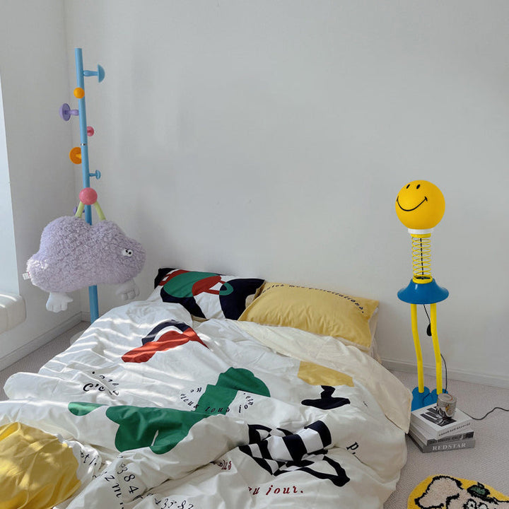 Lámpara de pie de hardware de PVC de 1 luz de primavera creativa contemporánea Smiley para sala de estar 