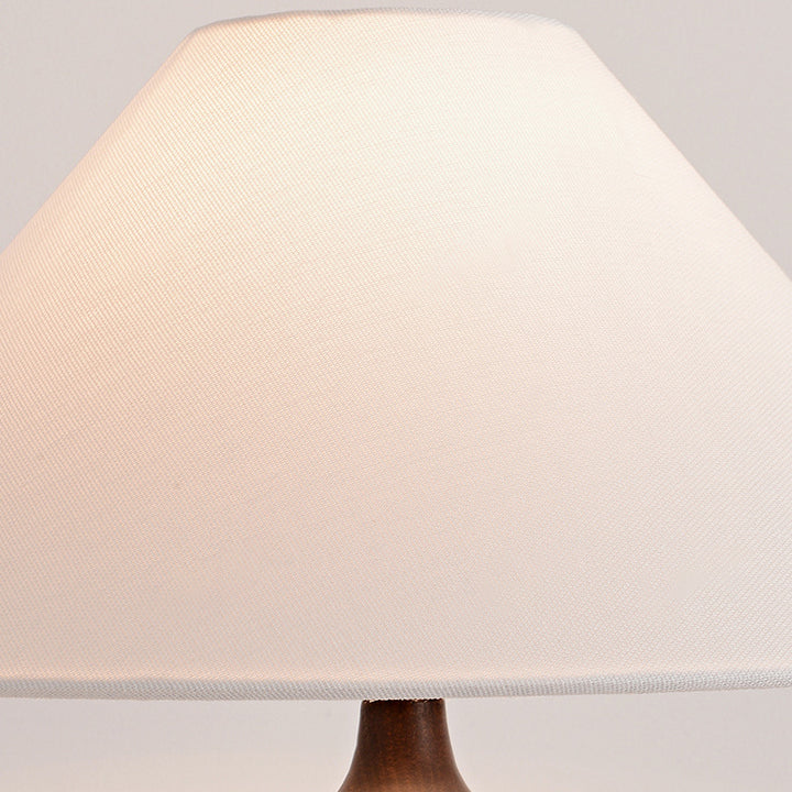 Lámpara de mesa contemporánea retro de madera de fresno y lino con pantalla trapezoidal redonda de 1 luz para dormitorio 