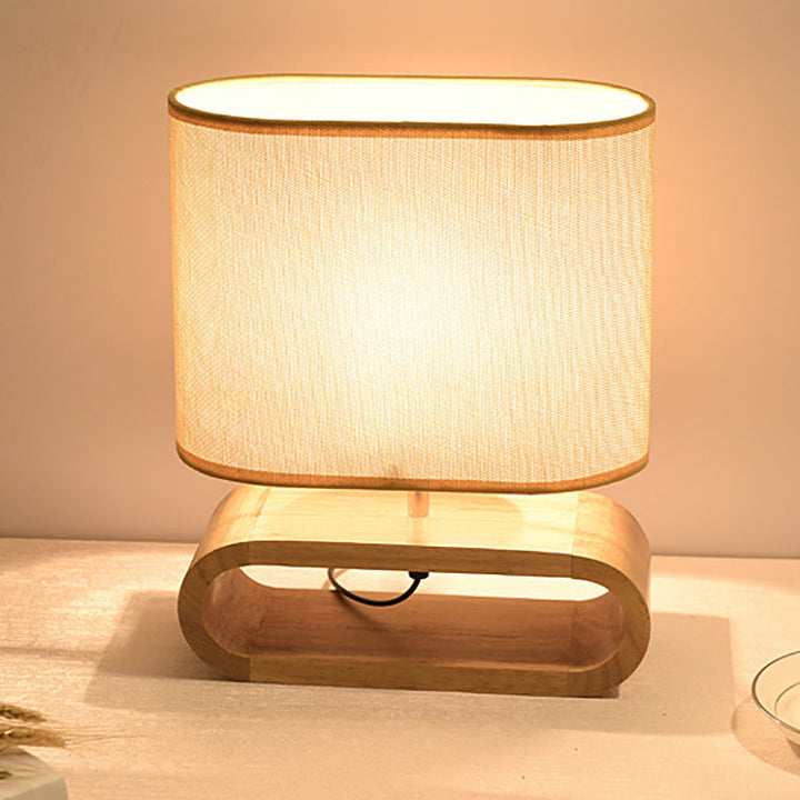 Lámpara de mesa contemporánea nórdica de cilindro de tela de madera elíptica de 1 luz para estudio 