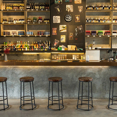 Tabouret de bar sans dossier en bois massif rond industriel contemporain avec cadre en fer et repose-pieds pour salle à manger 