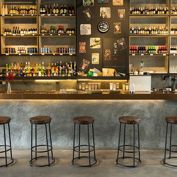 Tabouret de bar sans dossier en bois massif rond industriel contemporain avec cadre en fer et repose-pieds pour salle à manger 