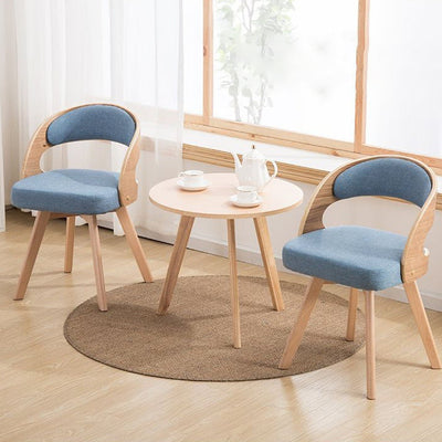 Chaise de salle à manger contemporaine en tissu nordique avec pieds en bois évasés et dossier courbé pour salle à manger 