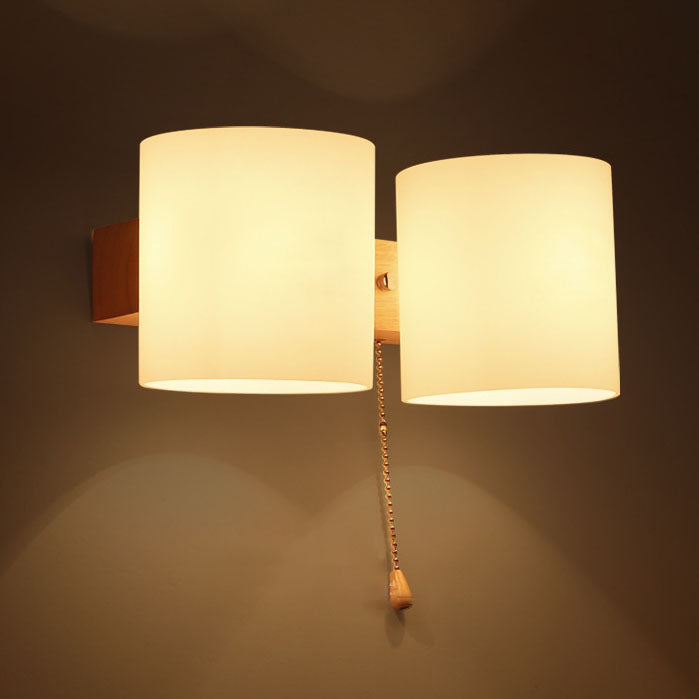 Moderne warme zylindrische Gummiholzglas 1/2 Licht Wandleuchte 