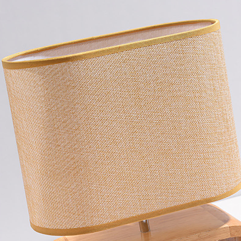 Lámpara de mesa contemporánea nórdica de cilindro de tela de madera elíptica de 1 luz para estudio 