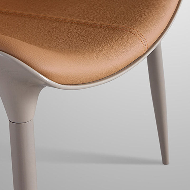 Chaise de salle à manger moderne en cuir de vache simplicité en acier éponge carrée avec dossier incurvé pour salle à manger 