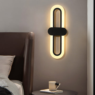 Applique murale LED en fer acrylique ovale de simplicité contemporaine pour salon 