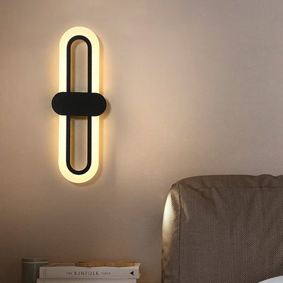 Applique murale LED en fer acrylique ovale de simplicité contemporaine pour salon 