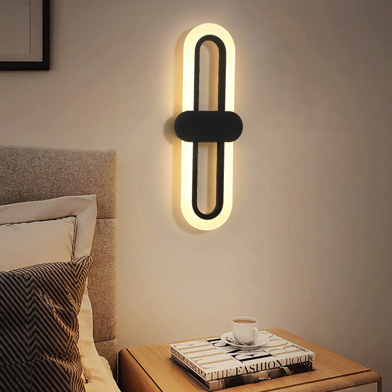 Applique murale LED en fer acrylique ovale de simplicité contemporaine pour salon 