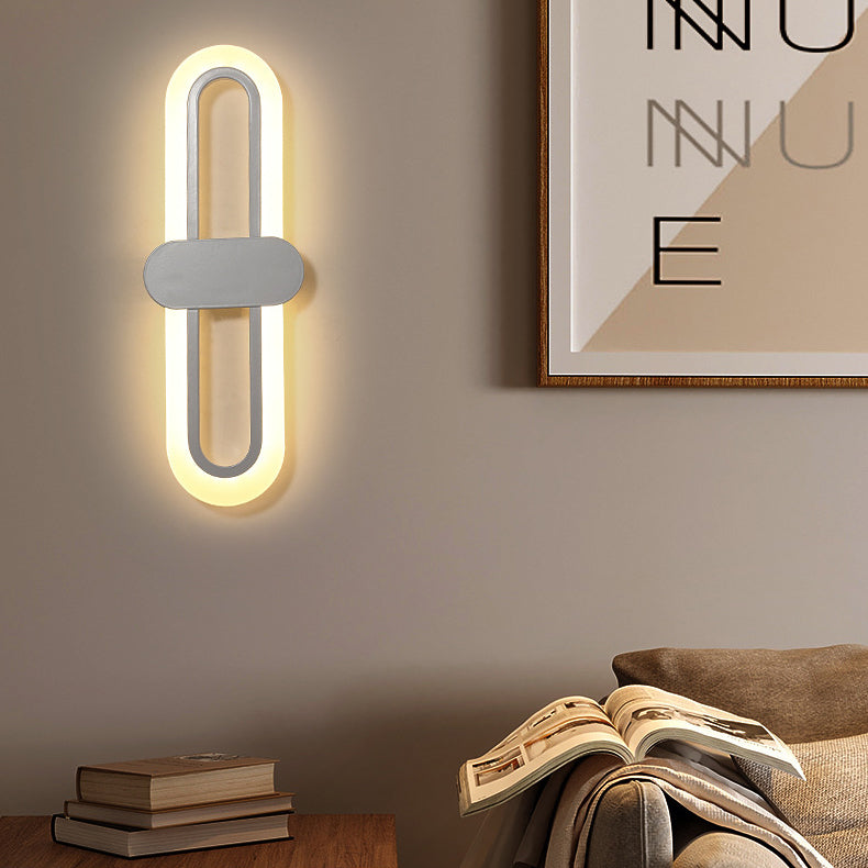 Applique murale LED en fer acrylique ovale de simplicité contemporaine pour salon 