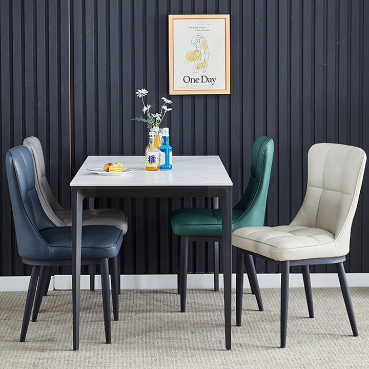 Silla de comedor de lujo contemporáneo rectangular de cuero PU de acero al carbono con respaldo sin brazos para comedor y cocina 