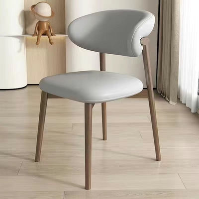 Silla de comedor contemporánea nórdica de madera y cuero sintético con respaldo redondo para comedor 