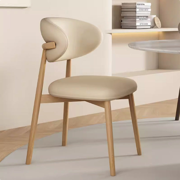 Silla de comedor contemporánea nórdica de madera y cuero sintético con respaldo redondo para comedor 