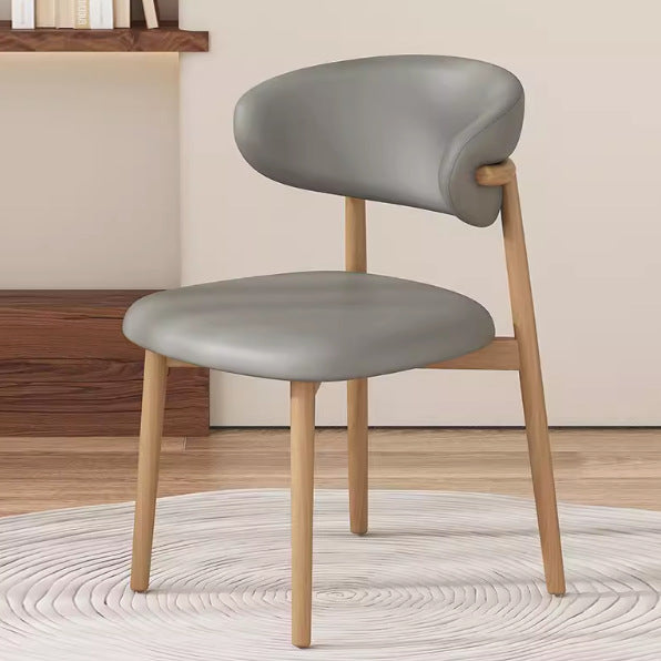 Silla de comedor contemporánea nórdica de madera y cuero sintético con respaldo redondo para comedor 