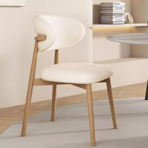 Silla de comedor contemporánea nórdica de madera y cuero sintético con respaldo redondo para comedor 